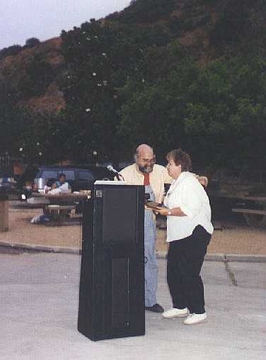 Mary Jo accepts Chell's plaque